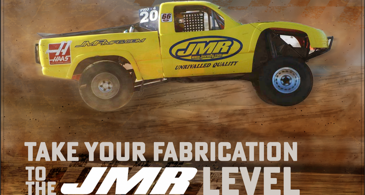 Yellow off-road truck with JMR branding on a brown background